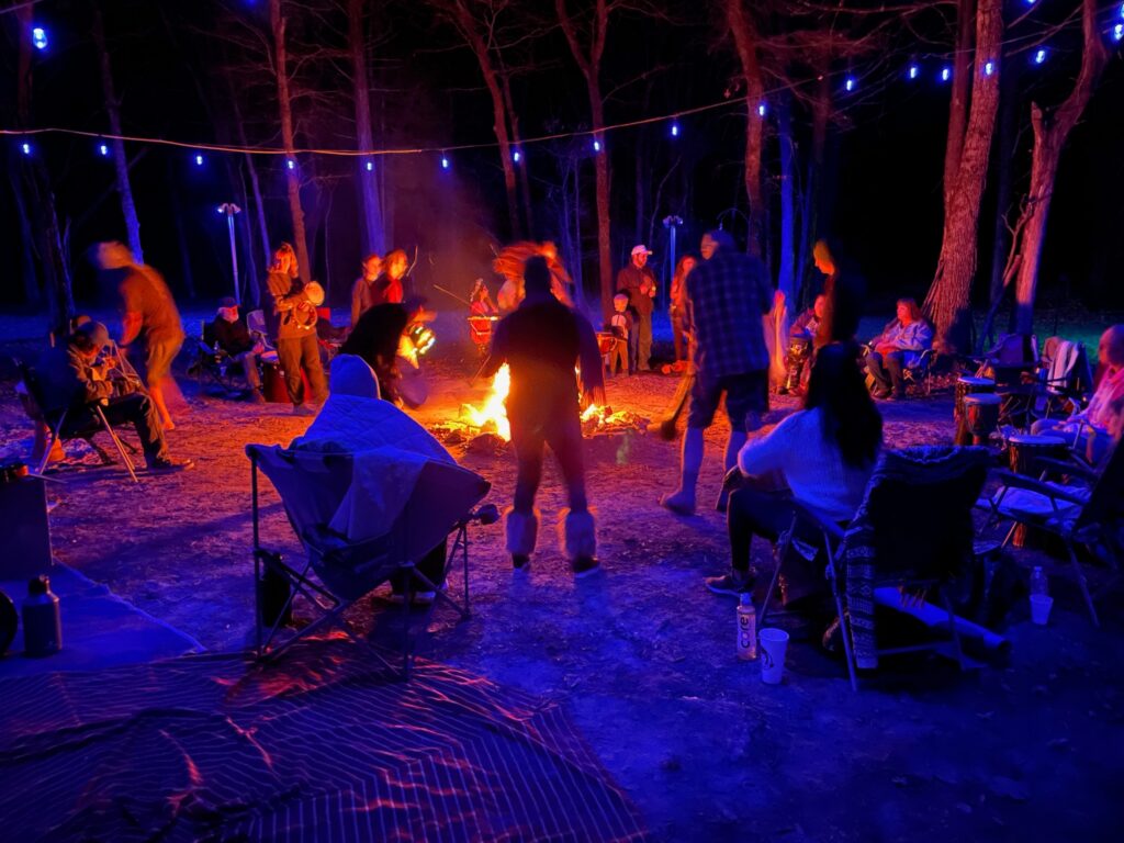Dancing and playing around the fire